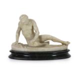 A late 19th century carved alabaster model of The Dying Gaul, on integral oval base, and moulded