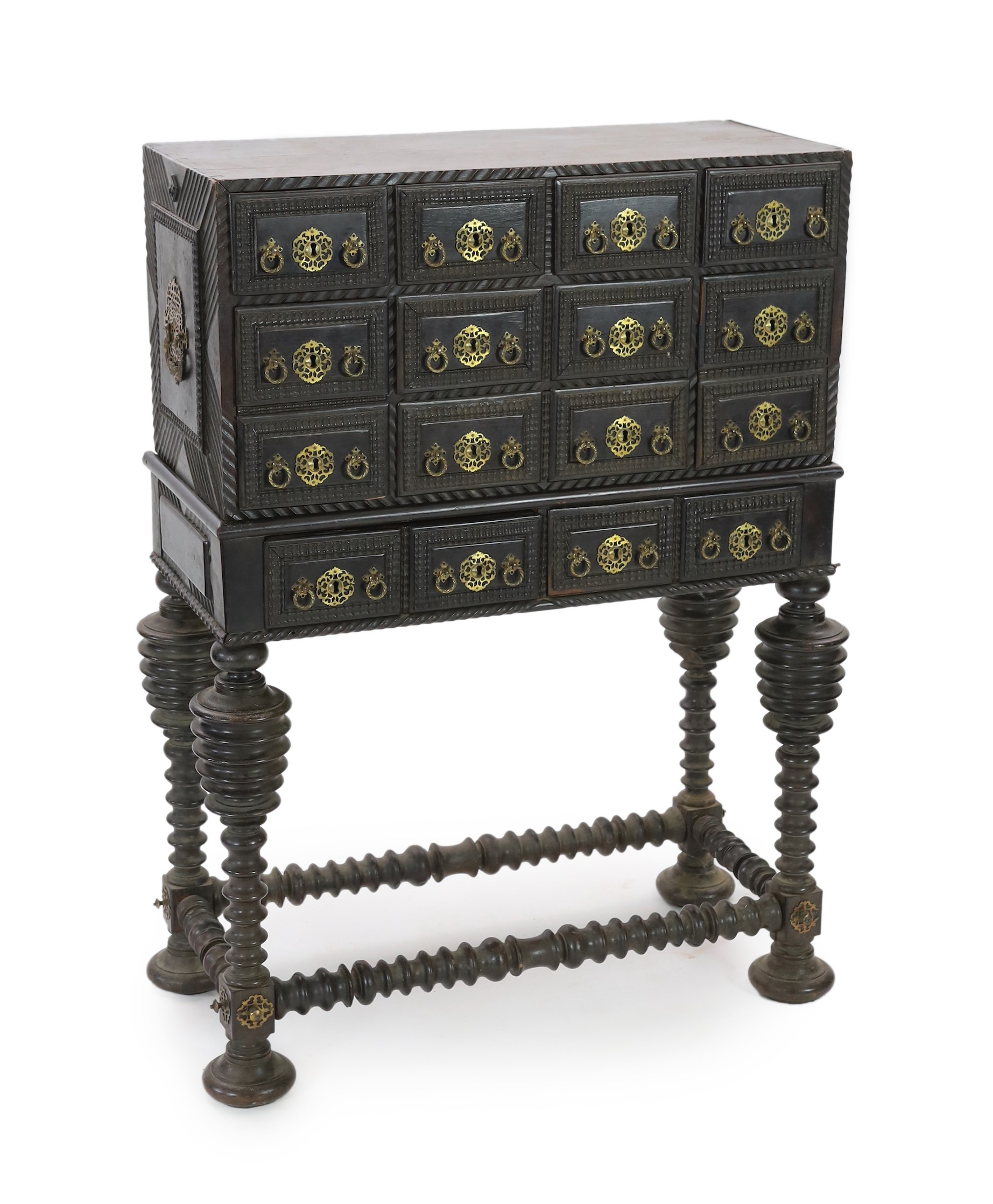 A 17th century Portuguese brass mounted ebonised rosewood Contador on stand With twelve ripple