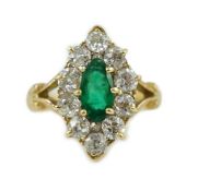 A Victorian style gold, emerald and diamond set marquise cluster shaped ring, the central emerald