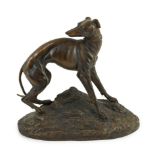 Jean Francois Théodore Gechter (French 1796-1844). A bronze model of a greyhound on naturalistic
