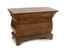An early 19th century Baltic region burr wood commode, with rectangular top and lyre shaped sides,