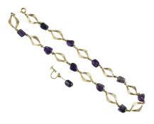 A modern textured 14ct gold and amethyst pebble set necklace and a similar earring, necklace,