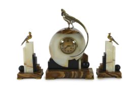 F.H. Danvin. A 1930's French Art Deco bronze mounted onyx and marble clock garniture, the central