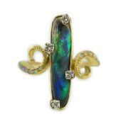 A stylish early to mid 20th century 18ct gold, black opal and diamond chip set dress ring, with