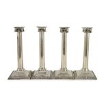 A set of three George III Corinthian silver ionic column candlesticks, by Thomas Shephard? London,