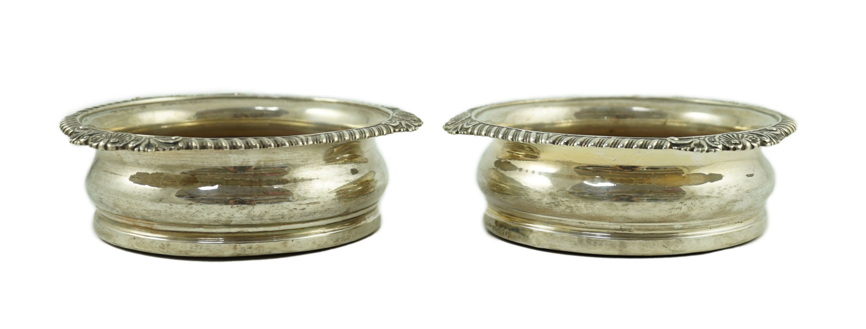 A pair of George IV silver wine coasters by Benjamin Smith III, with gadrooned and shell border, the - Image 3 of 11