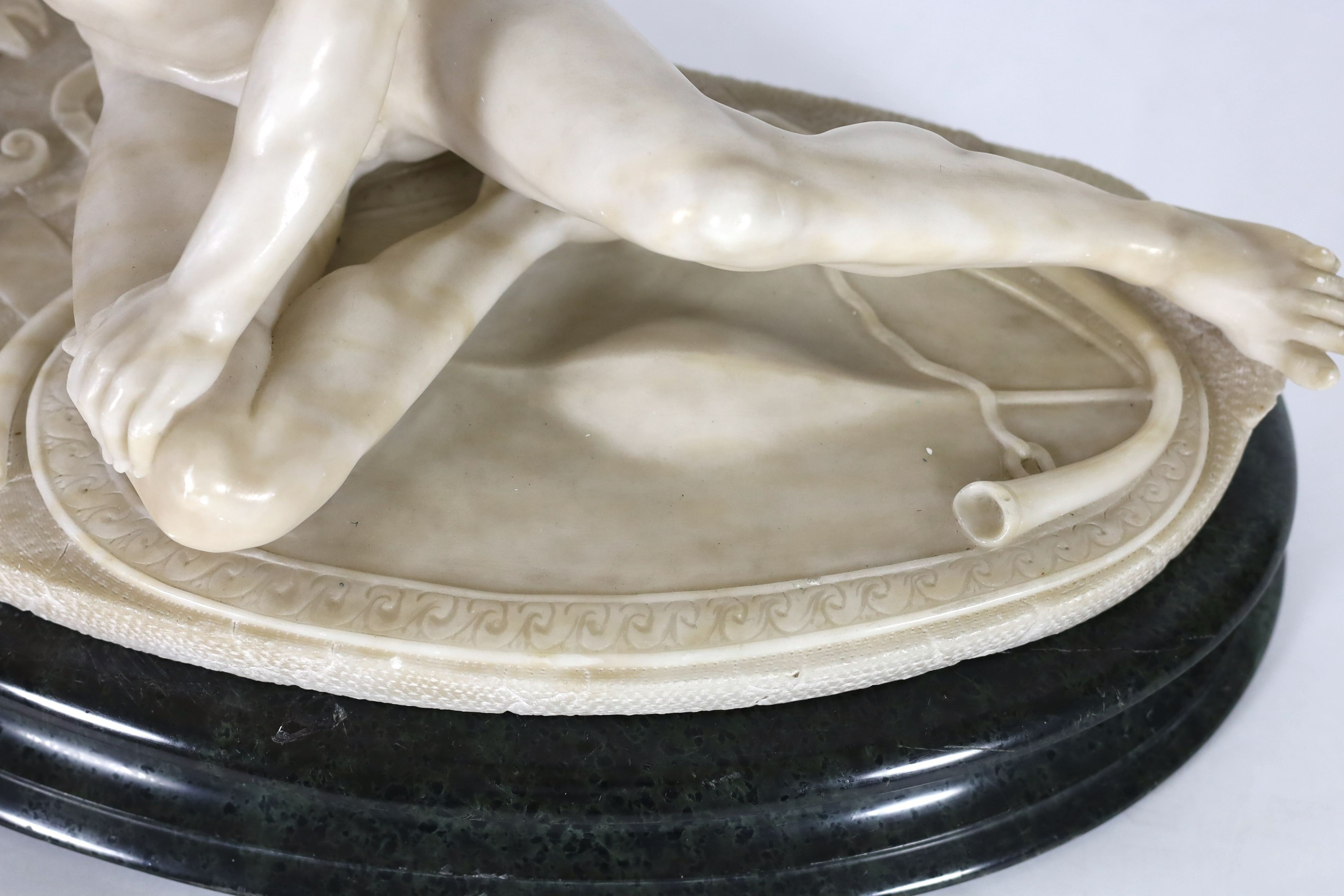 A late 19th century carved alabaster model of The Dying Gaul, on integral oval base, and moulded - Image 3 of 6