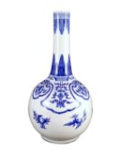 A large Chinese blue and white bottle vase, 19th century, painted with leaf and flower sprays and