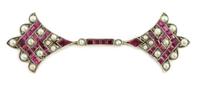 An early 20th century, gold, platinum, ruby and seed pearl set brooch, with fan shaped terminals,