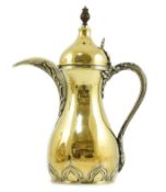 A late 1970's parcel gilt silver coffee pot, modelled as a dallah, by Asprey & Co Ltd, London, 1979,