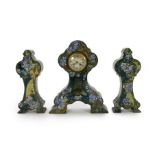 A Rozenberg Art Nouveau earthenware three piece clock garniture, decorated with lilac pansies on a