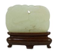 A Chinese white jade ‘tiger and dragon’ plaque, 18th/19th century one side carved in low relief with