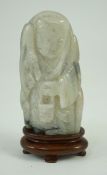 A Chinese white, grey and russet jade figure of Zhou Yanzi, Ming dynasty, the crouching figure