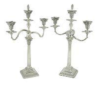 A pair of late Victorian silver two branch, three light Corinthian column candelabra, by