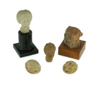 A group of antiquities comprising two commemorative scarabs, an Egyptian style gypsum head, and