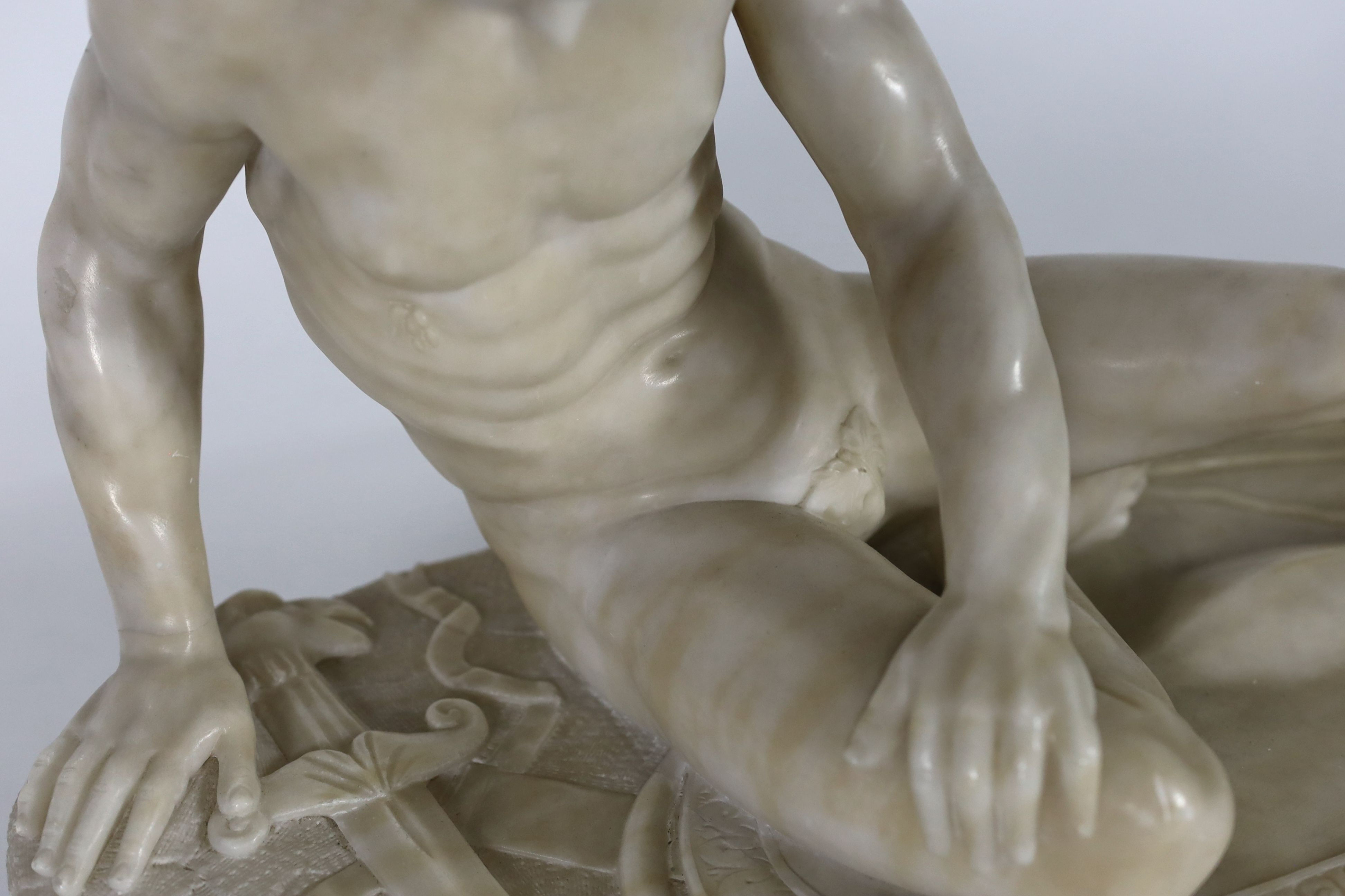 A late 19th century carved alabaster model of The Dying Gaul, on integral oval base, and moulded - Image 5 of 6