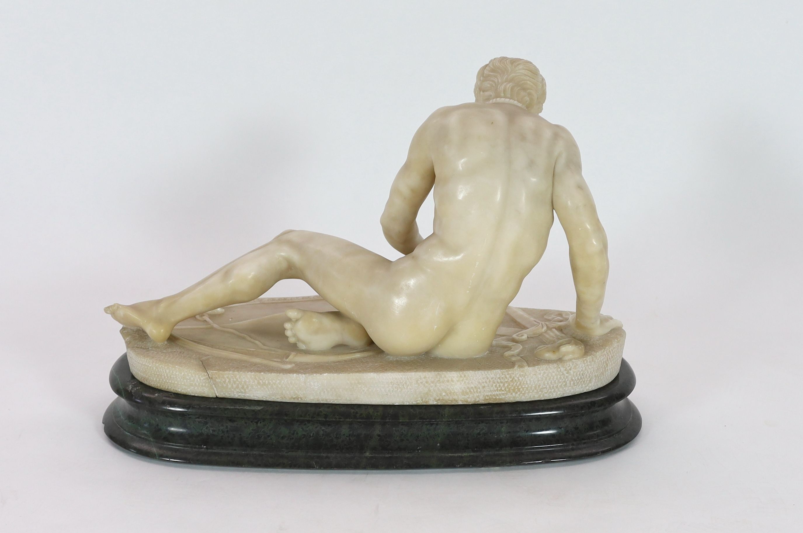 A late 19th century carved alabaster model of The Dying Gaul, on integral oval base, and moulded - Image 6 of 6