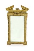 A George II carved giltwood Adam design wall mirror, with broken arch pediment, raised flower and