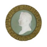 A 19th century French bisque plaque of Napoleon, within floral ormolu frame, diameter 14cmBisque