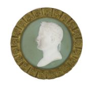 A 19th century French bisque plaque of Napoleon, within floral ormolu frame, diameter 14cmBisque