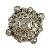 A Victorian pierced gold, silver and rose cut diamond set pendant brooch, of shaped circular form,