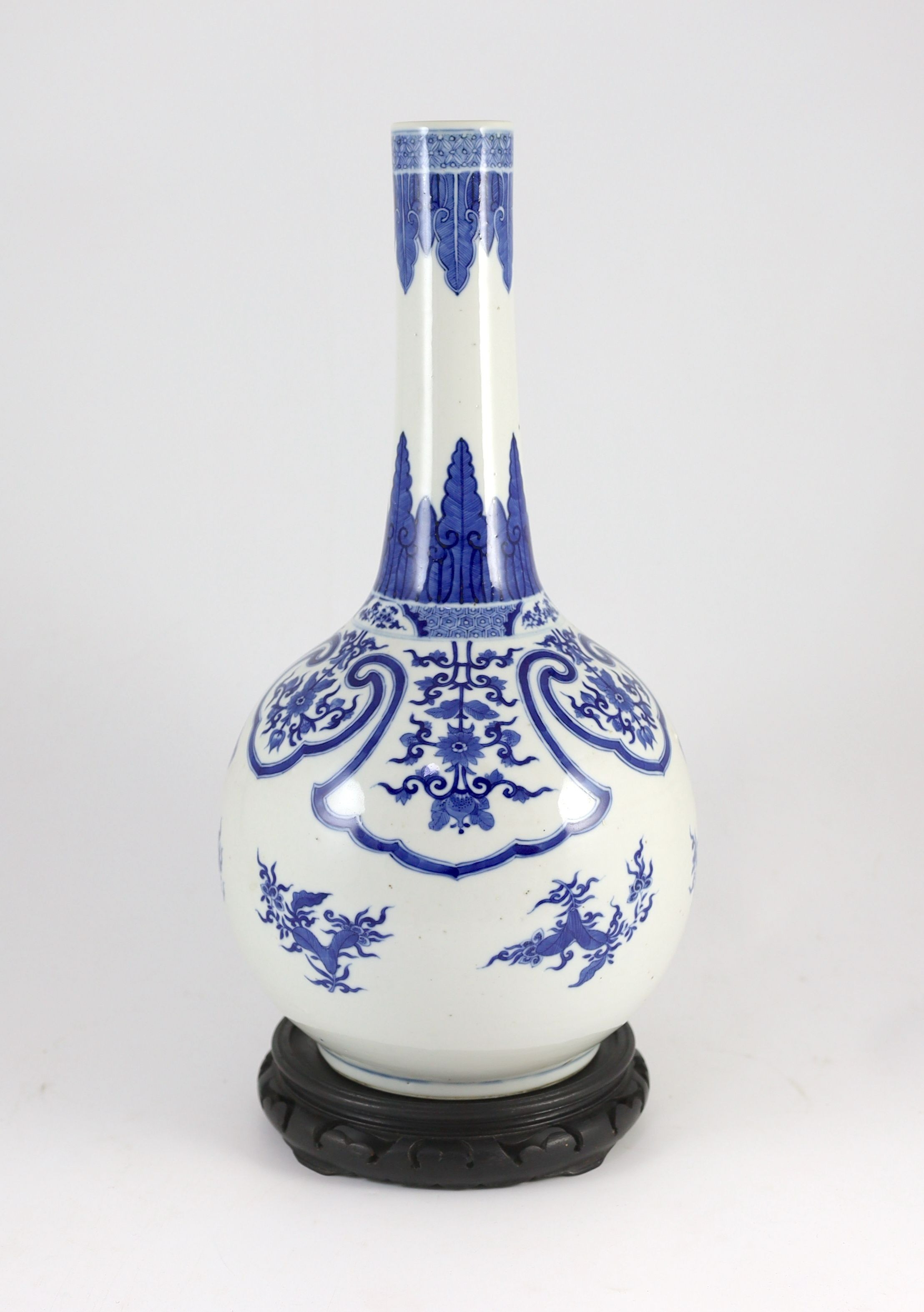 A large Chinese blue and white bottle vase, 19th century, painted with leaf and flower sprays and - Image 2 of 5