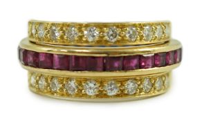 An 18k gold, ruby, sapphire and diamond set triple band swivel ring, size M, gross weight 7.2