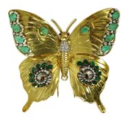 A modern 18ct gold, emerald and diamond set butterfly clip brooch, with ruby set eyes, oval and