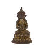A Tibetan gilt copper alloy figure of Amitayus, 16th/17th century, on a double lotus throne,