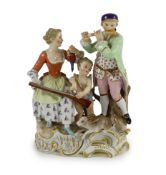 A Meissen Group of a young couple, Cupid and a hare, 19th century, blue crossed swords mark and