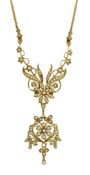 A late Victorian 15ct gold and seed pearl set drop pendant necklace, of scrolling form, with rope