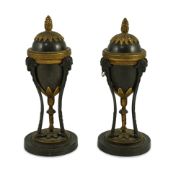 A pair of Louis XVI style bronze and ormolu cassolets with goats head terminals and loaded