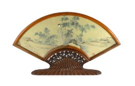 A Chinese painted and inscribed gilt paper fan leaf, 19th century, painted with a lady standing in a