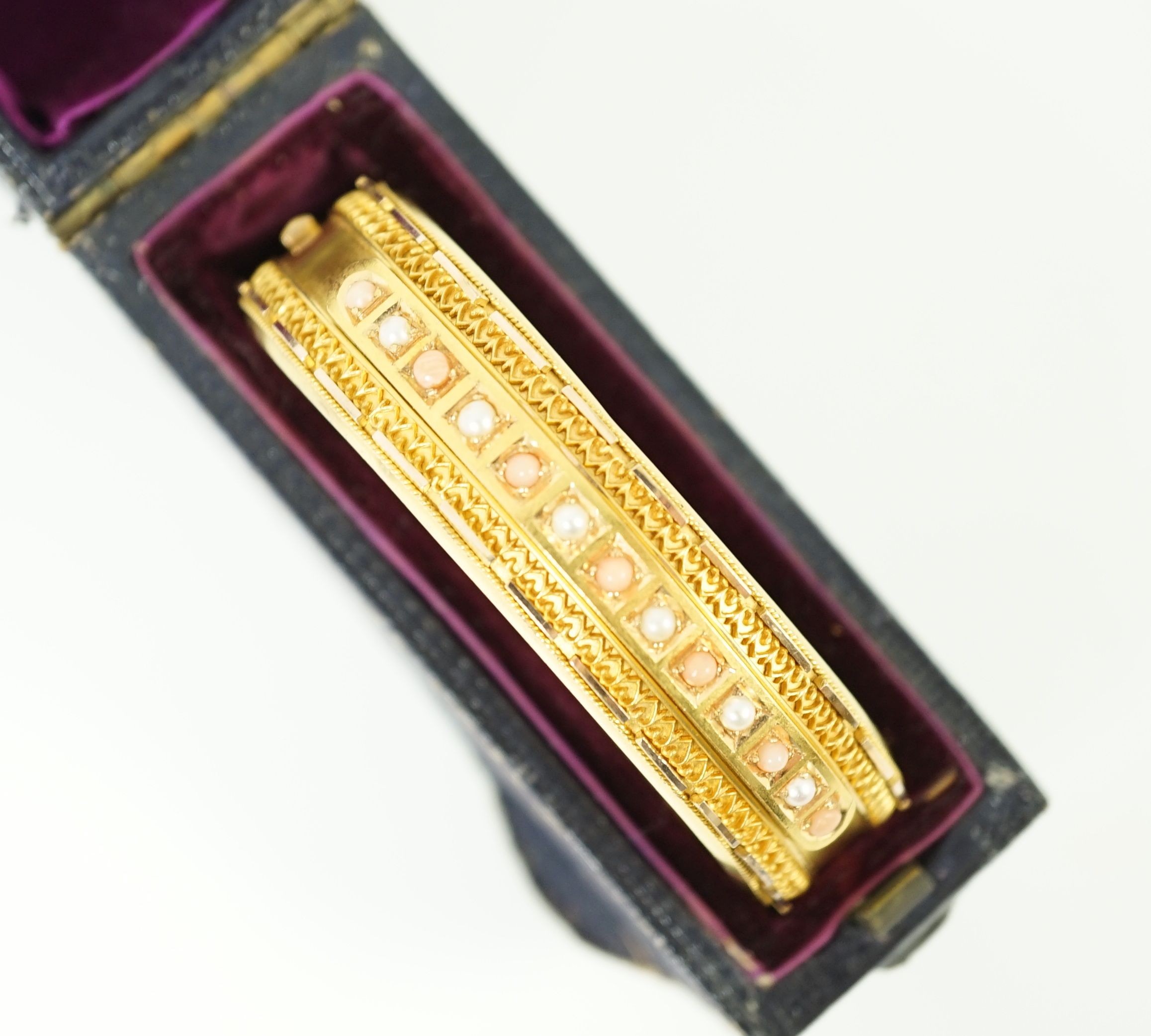 A late Victorian 15ct gold coral bead and seed pearl set part cannetile work hinged bangle, inner - Image 9 of 11