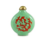 A Chinese enamel on copper green ground snuff bottle, 19th/20th century, enamelled in red with a