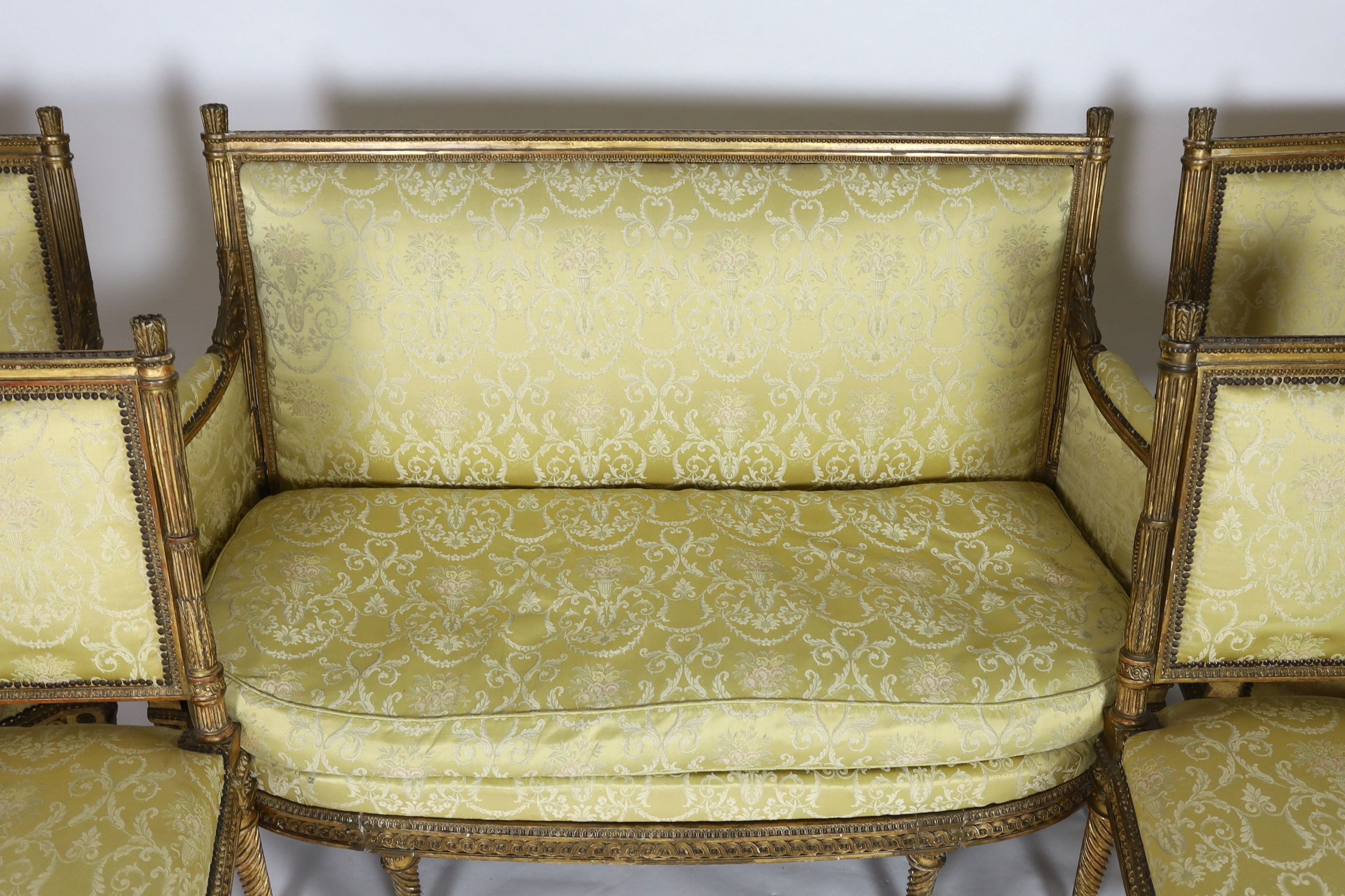 A Louis XVI carved giltwood five piece salon suite, comprising settee, pair of armchairs and pair of - Image 2 of 5