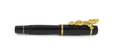 A Mont Blanc Year of the Golden Dragon fountain pen, the cap applied with a dragon holding a pearl