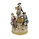 A Meissen group of the three winemakers, 19th century, after a model by Michel Victor Acier, blue