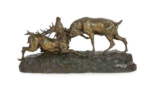 Thomas-Francois Cartier (1879-1943). A bronzed group of rutting stags, standing upon a