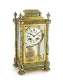 An early 20th century French ormolu and champleve enamel four glass mantel clock, with architectural