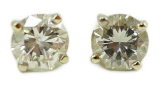 A pair of 18ct white gold and solitaire diamond set ear studs, each stone weighing approximately 0.