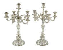 A pair of late 19th century German 800 standard white metal Rococo style, five branch, six light