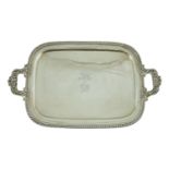 A George IV silver two-handled rounded rectangular tea tray, by The Barnards, with gadrooned