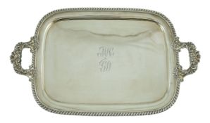 A George IV silver two-handled rounded rectangular tea tray, by The Barnards, with gadrooned