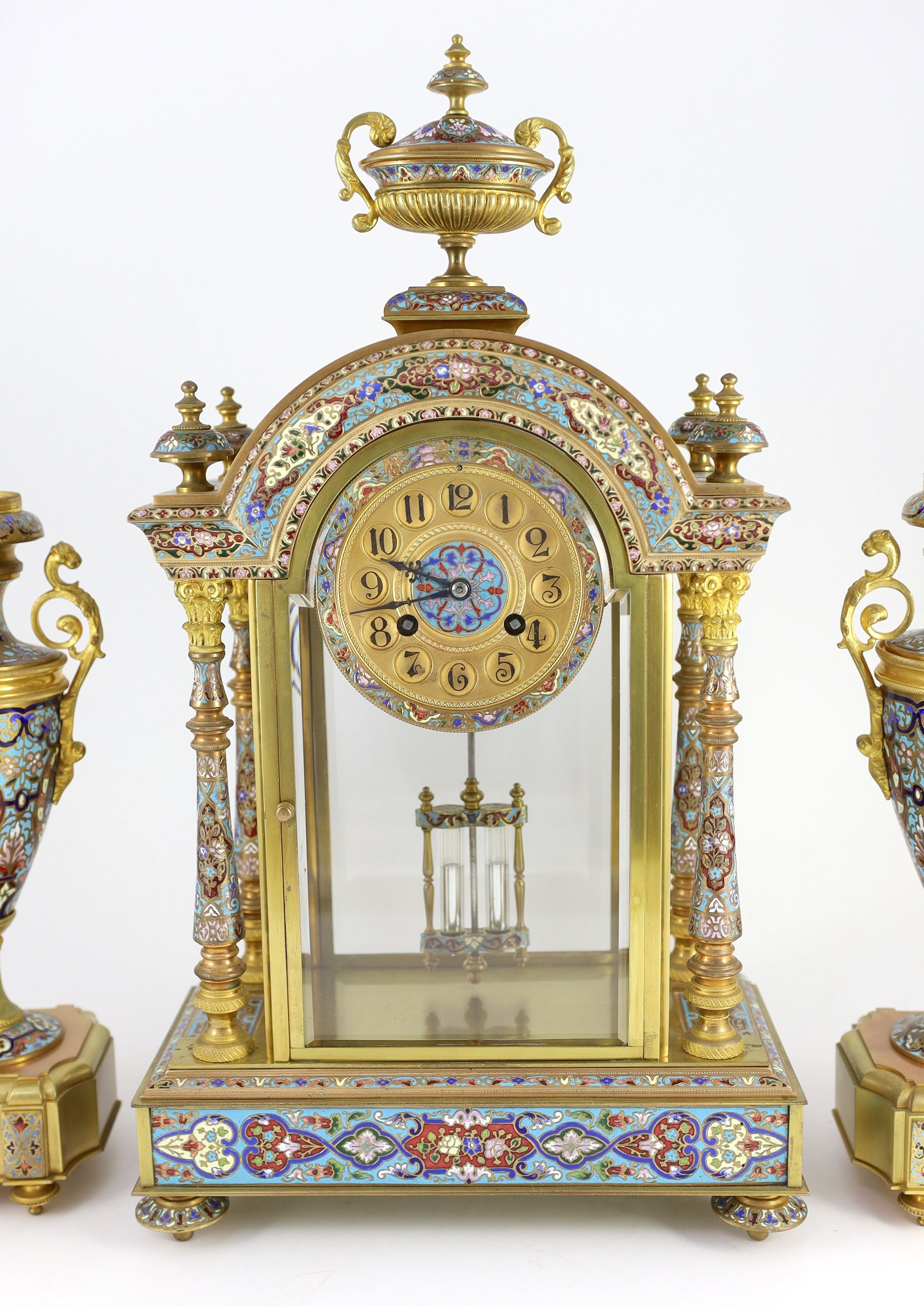 An early 20th century French ormolu and champleve enamel clock garniture, the mantel clock of - Image 3 of 6