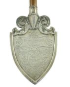 A large George V silver mounted oak presentation spade, by Vaughton & Sons, with inscription