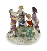 A Meissen group of four dancing children, early 20th century, blue crossed swords mark and incised