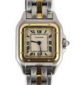 A lady's steel and gold Cartier Panthere quartz wrist watch, with Roman dial and cabochon set crown,