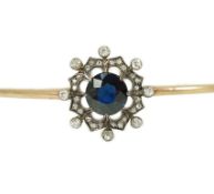 A Victorian gold, sapphire and diamond cluster set hinged bangle, interior diameter approx. 57mm,