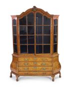 A 19th-century Dutch marquetry and walnut display cabinet with two glazed barred doors enclosing